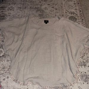 This is a tan blouse by JM collection